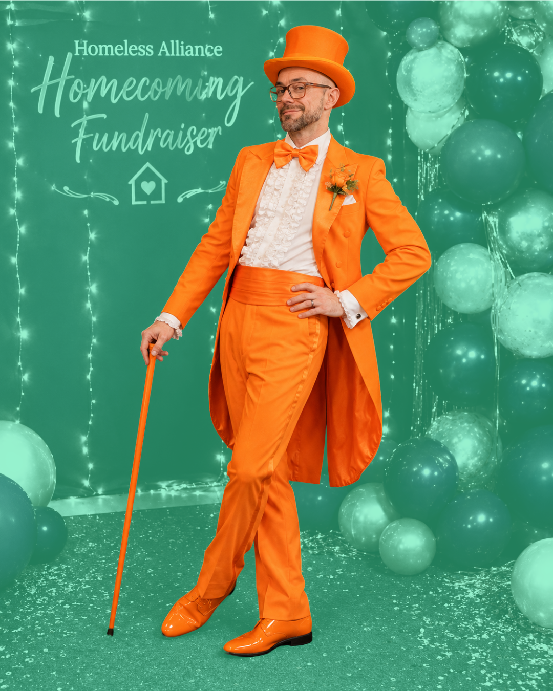 Aaron Diehl in a traffic-cone-orange tuxedo and top hat for the Homeless Alliance Homecoming Fundraiser