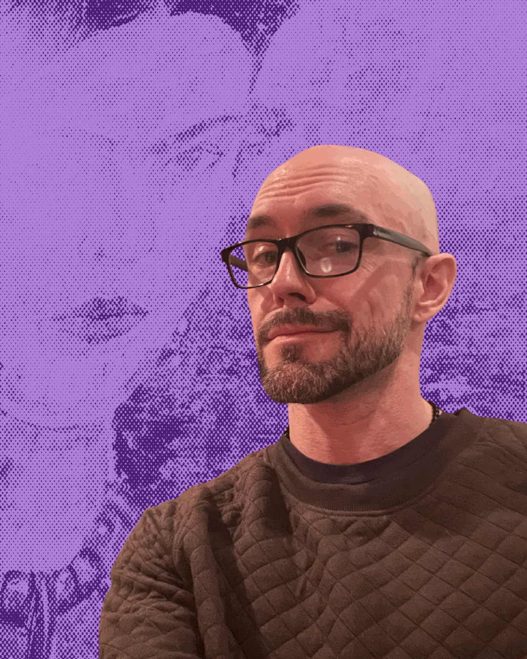 Aaron Diehl in an olive quilted sweater, standing in front of a Frida Kahlo painting