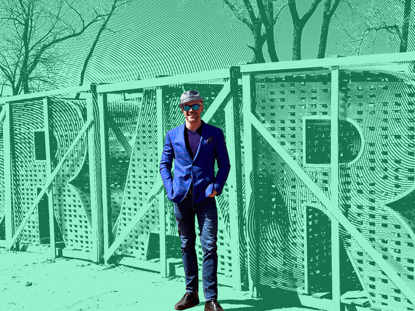 Aaron Diehl in a purple blazer standing in a framed wall on the open Oklahoma prairie