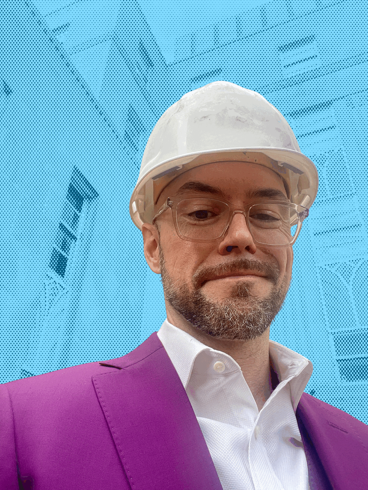 Aaron Diehl in a purple blazer and Redhawks hardhat in front of a gothic Oklahoma City building